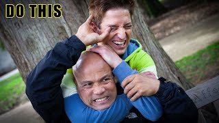 How to escape a standing rear choke Master Wong teaches basic cover...