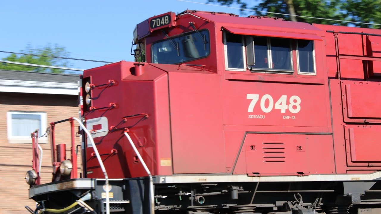 Canadian Pacific 7048 leads a grain train at Le Claire, Iowa. - YouTube