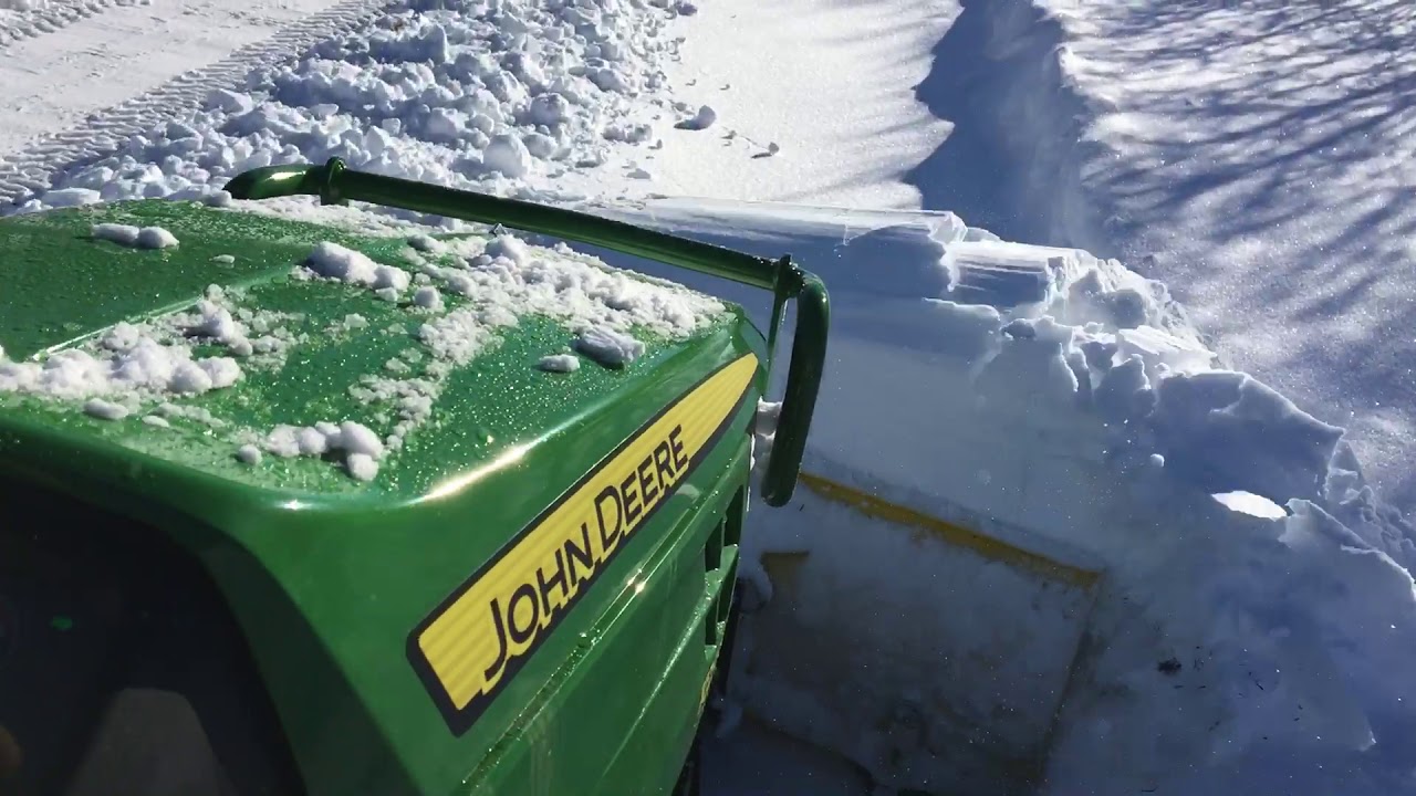 1025R plowing deep snow 6 to 25 inches uphill YouTube
