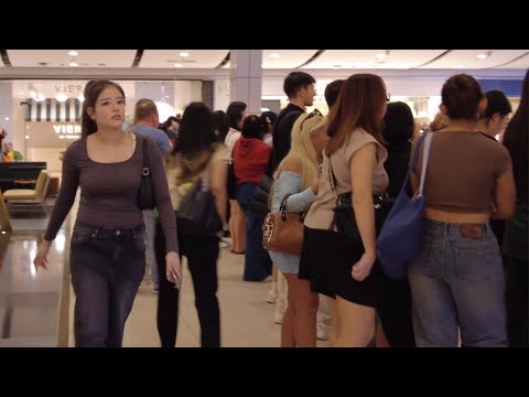 In a Bangkok shopping mall, a plump girl came over