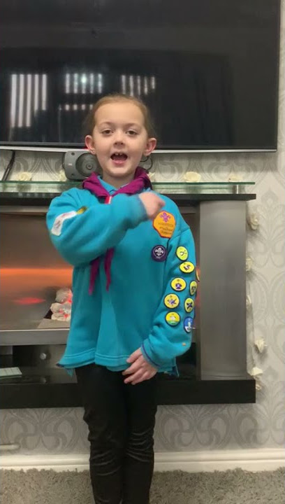 7-year-old Scout Megan learns to sign the #Scout promise to make her group more accessible