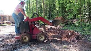 Digging a shallow Drainage ditch with a Toro Dingo 222