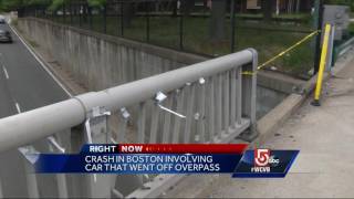 Speeding car crashes off Boston overpass
