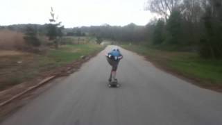 Downhill longboarding fast turn raw run