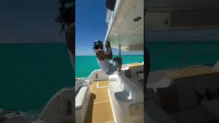 Jim Jones doing pull ups on a yacht