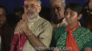 Narendra Modi gives a speech in Gujarati, next to Maya Kodnani