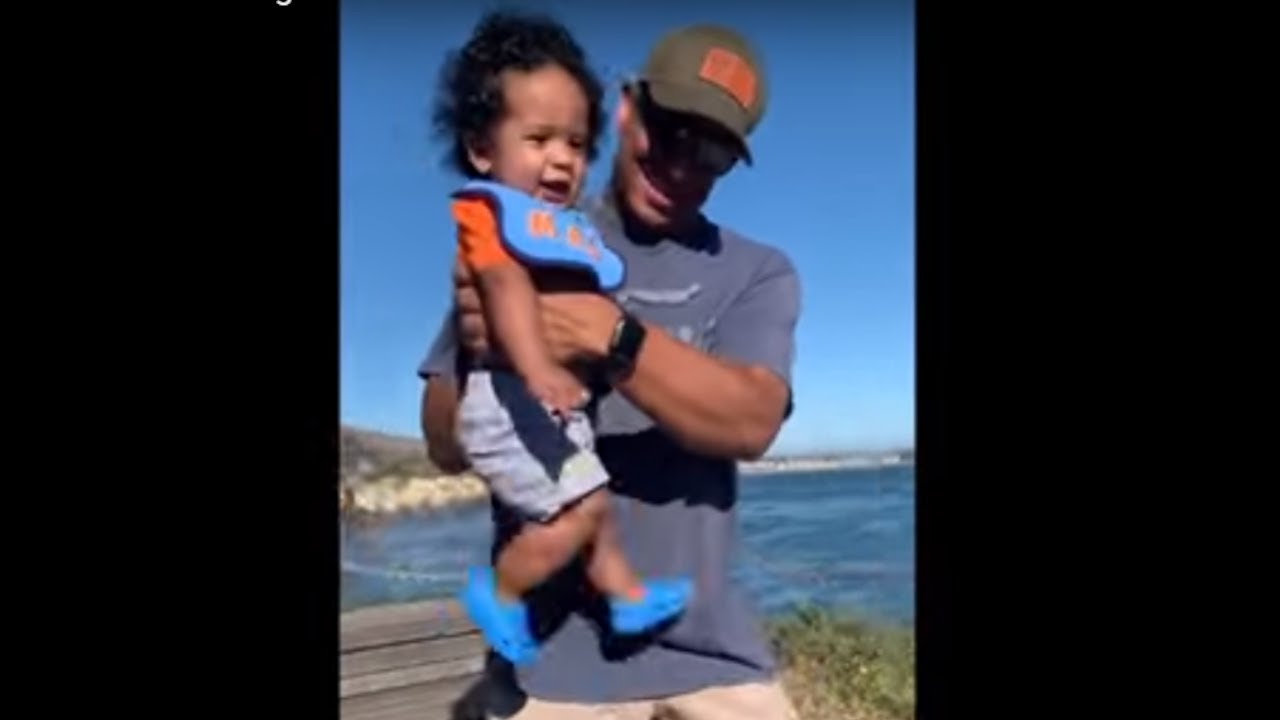 Cute little baby practices "air running" skills