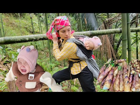 A single mother carries her young child on her back while cutting bamboo to repair her house.