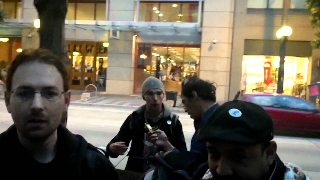 Occupy Seattle Hipster protesters abuse and spit on a homeless guy