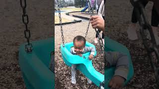 Grandson Davion and granddaughter Aaliyah on the swing