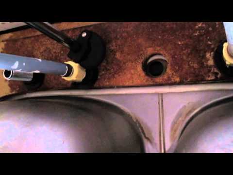 How to loosen kitchen faucet nuts with a basin wrench