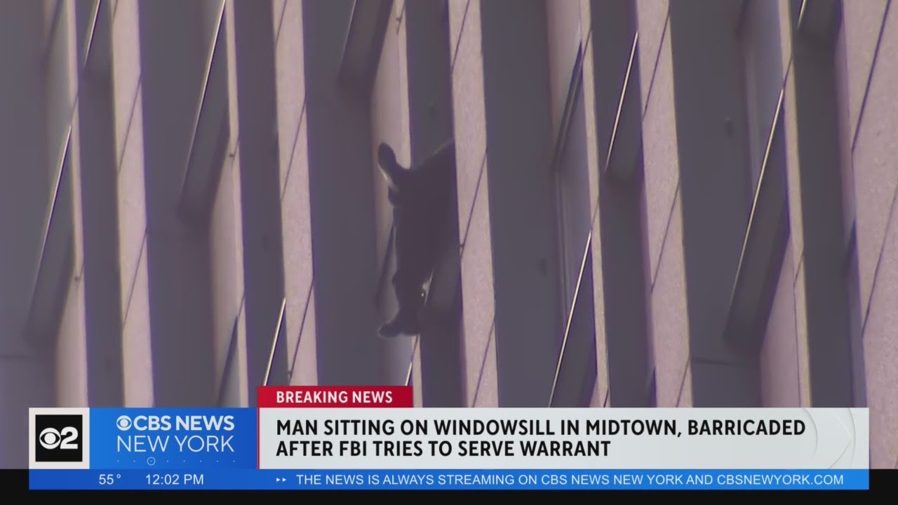 Man sitting on Midtown window after FBI attempts to serve warrant