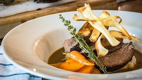 Pot roasted beef brisket with root vegetable mash, parsnip crisps and horseradish by Food Urchin