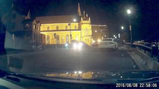 Idiot biker blocks traffic showing off and lays his bike down.