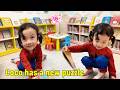Coco took her dad to the library to buy an Ultraman puzzle, which was so exciting!