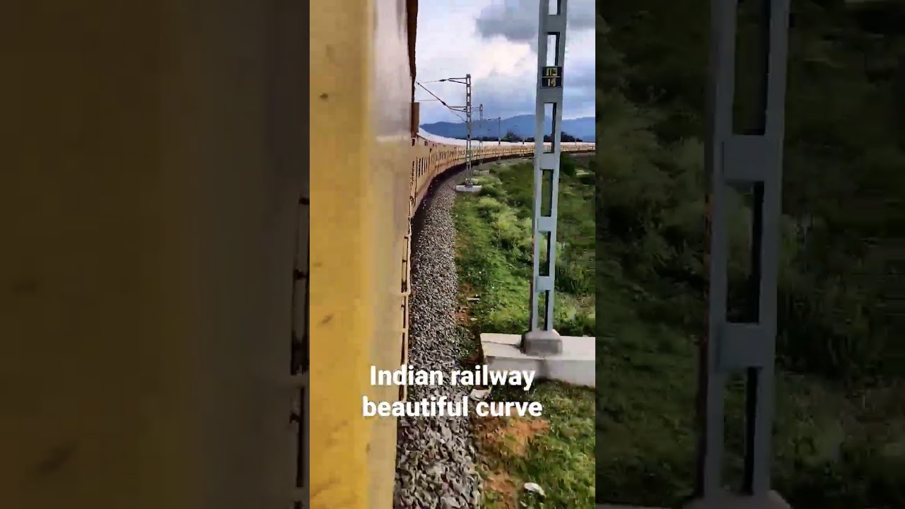 Indian train passing beautiful curve.