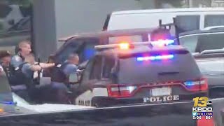 Driver in stolen vehicle escapes police blockade, crashes into business, escapes, remains at ...