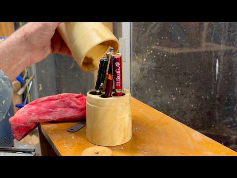 Richard Raffan turns a lidded box-elder pen caddy .