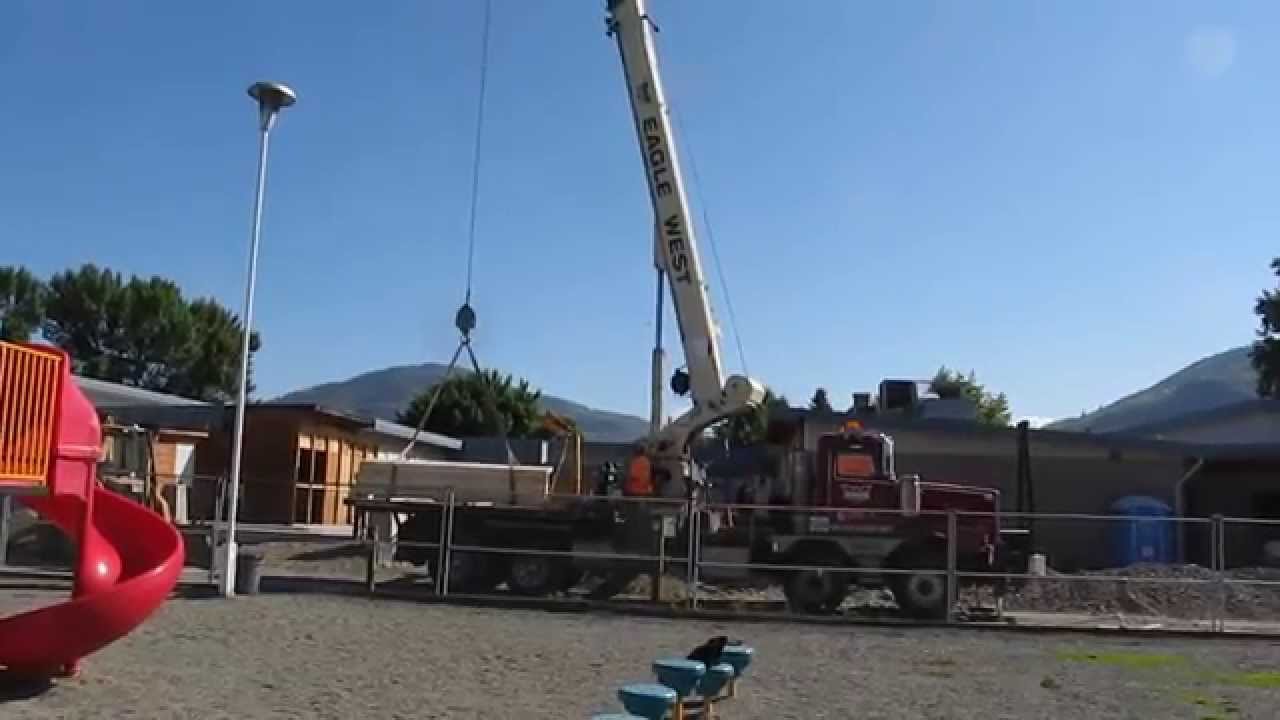 John Tod: Eagle West Crane with a sling of lumber.