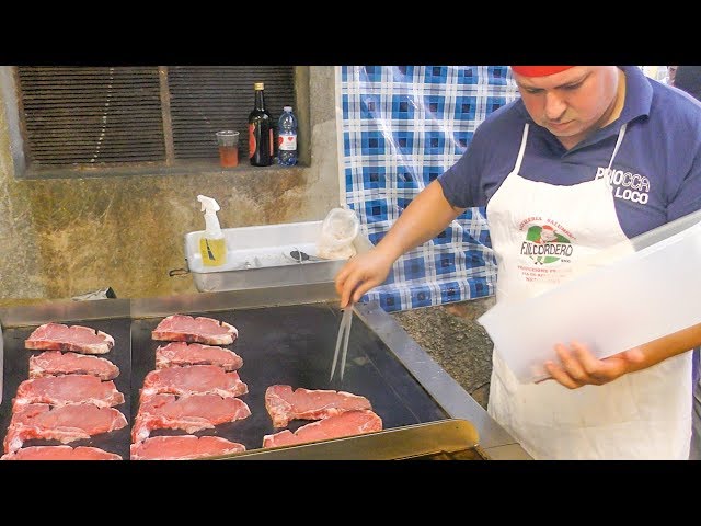 Many Large T-Bone Steaks of Veal Grilled, Costata di Vitello. Italy Street Food