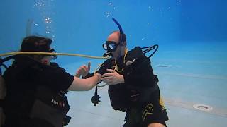 Students practice buddy breathing skills in Tallahassee SCUBA instructor Gabrielle's class