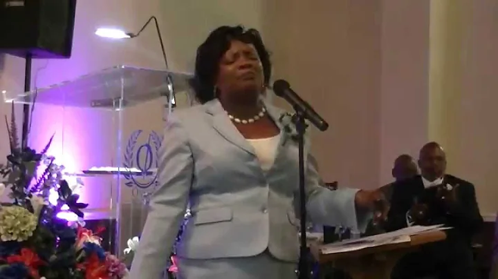 Minister L. Cynthia Burnett sings "Safe In His Arm...