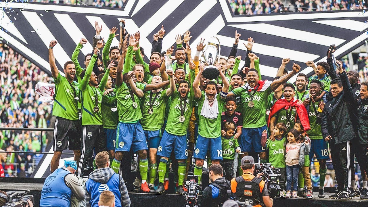 Seattle Sounders FC lift the Philip F. Anschutz trophy after winning