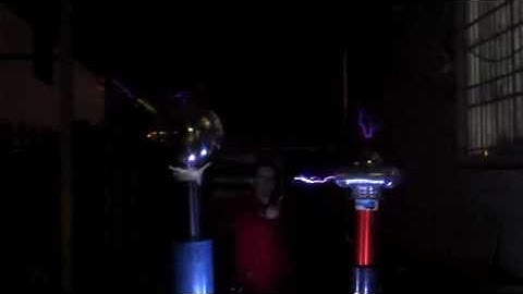 Pip Catching Lightning Off Dual Tesla Coils