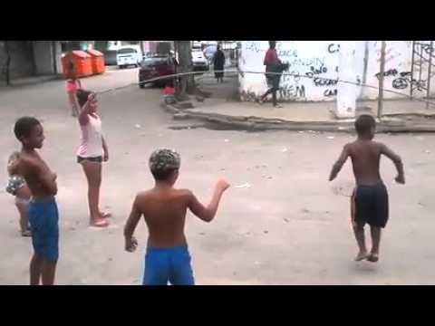 Dog plays jump rope with kids