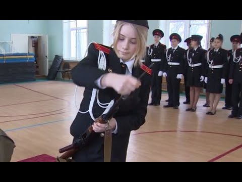Beautiful Russian School girl assembling an AK-47 in seconds