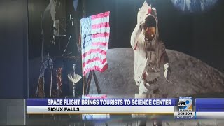 Space flight brings tourists to science center