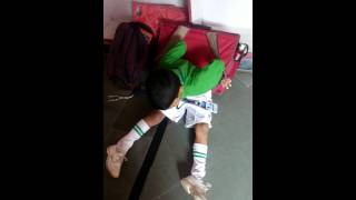 School Child Struggle to lift  bag