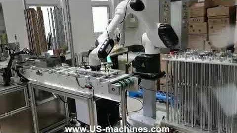 Ice cream lid spoon assembly machine with robot hand sorting stacking system