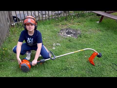 The first mowing of the grass with a Husqvarna 122C trimmer