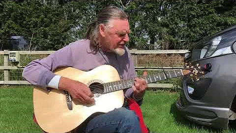 Roger Pugh playing his Jester Guitar