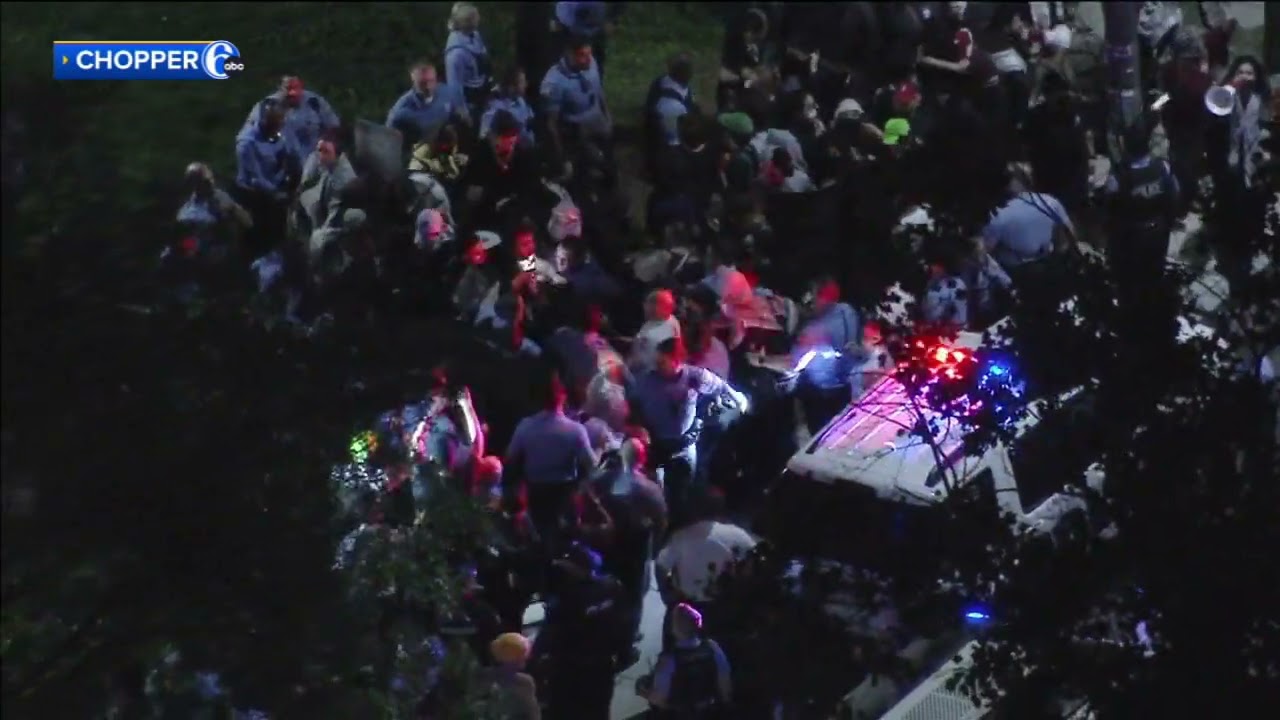Philadelphia police scuffle with protesters during demonstration on Penn's campus