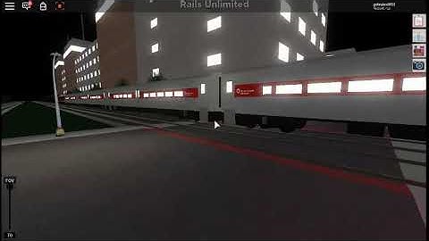 Rails unlimited. train passing Pinewood crossing