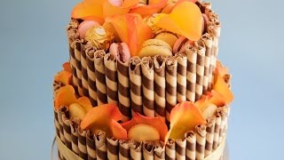 In this tutorial i demonstrate how to create a super dooper easy 2
tier cake decorated with chocolate wafer sticks, fresh rose petal,
macarons and chocolates...