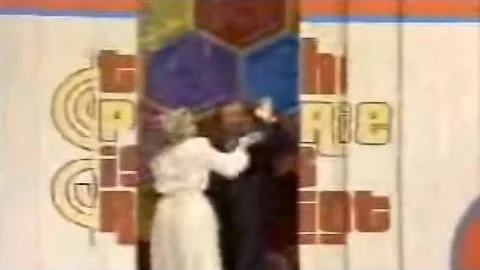Bob Barker kisses model Dian Parkinson