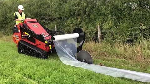 Ditch Witch Skid Steer installing Newt Fencing