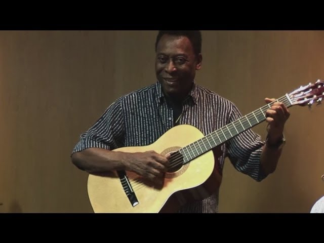 Pele plays guitar during UK charity visit 