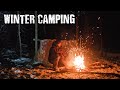 Winter camping on a mountain in a very warm survival shelter made with cheap materials