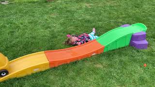 Girl falls off Hot Wheels track on to grass