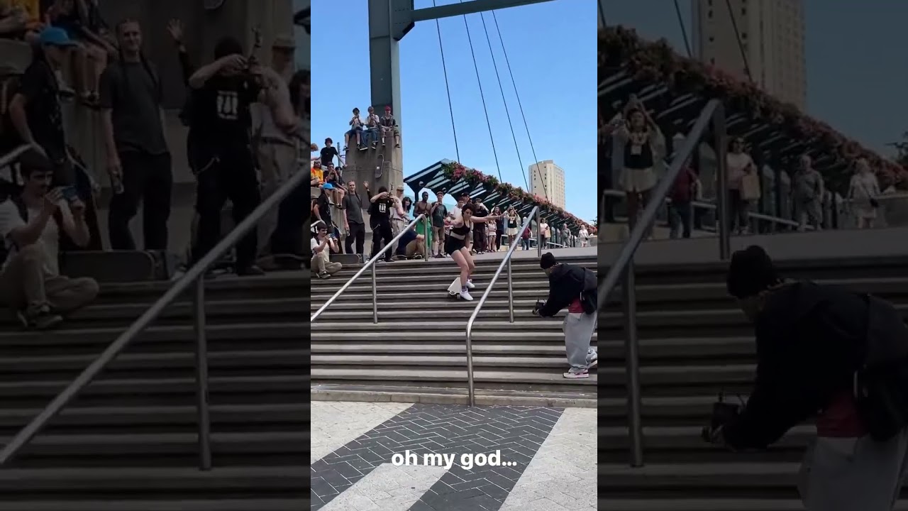 Girl rides longboard skateboard down stairs then fall forward and lands on head