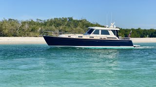 Nice Boat Cruising Through Wiggins Pass in North Naples, FL