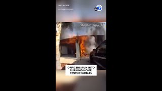 Officers run into burning home, rescue woman