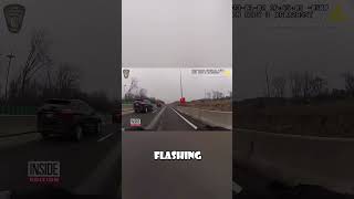 Police Officer Saves Terrified Cat On Busy Highway