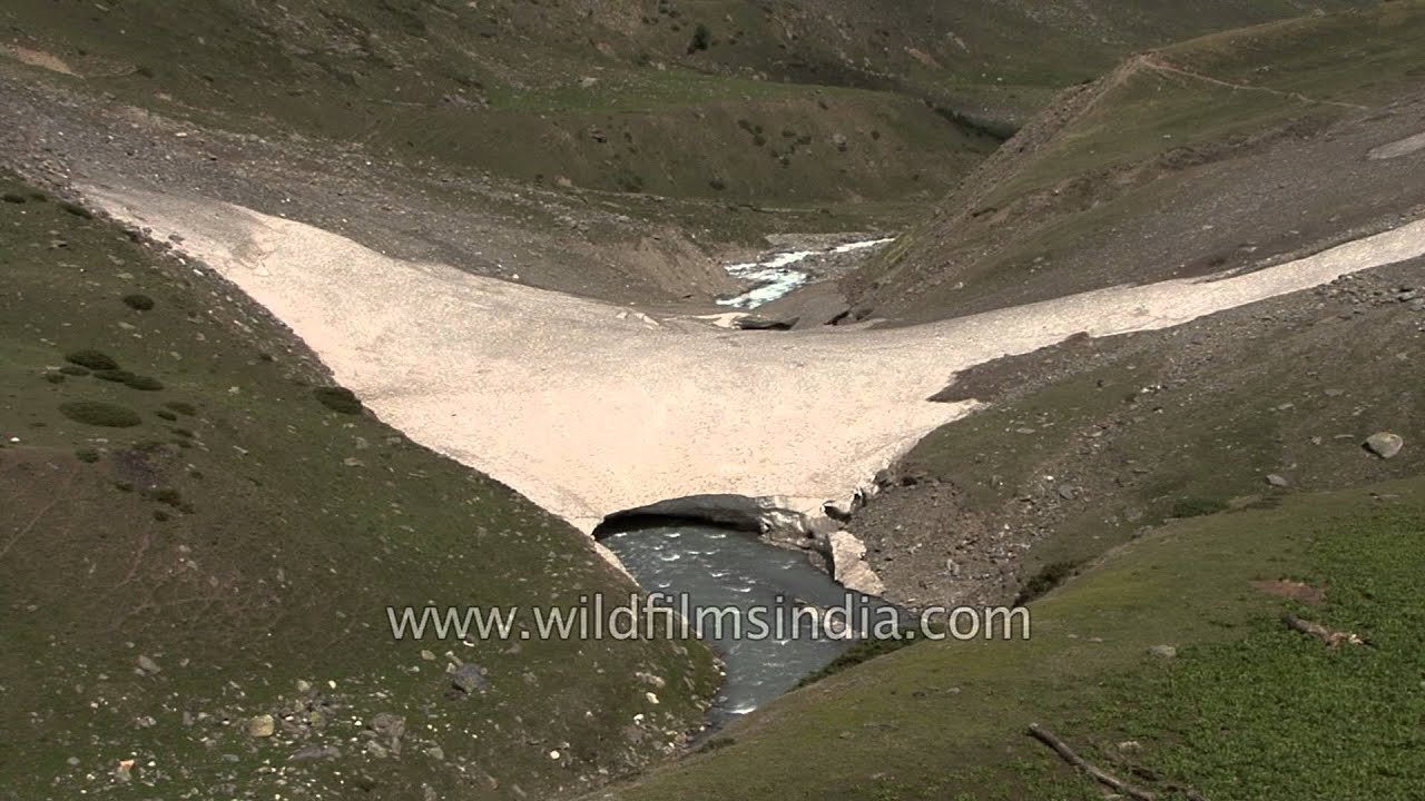 Natural snow tongue and ice bridge formation: Gidara meadow
