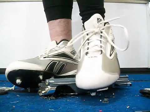 Barefeet and football cleats crush car