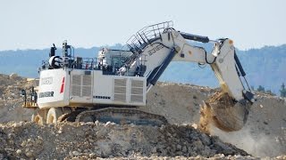 Liebherr R9350 loads Komatsu HD785-7